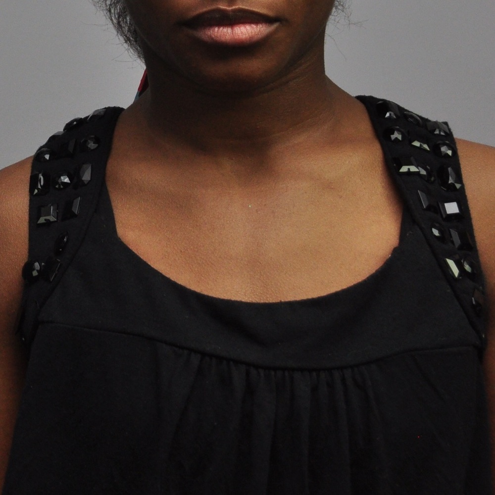 Black sleeveless tunic tank with black stones details on shoulders